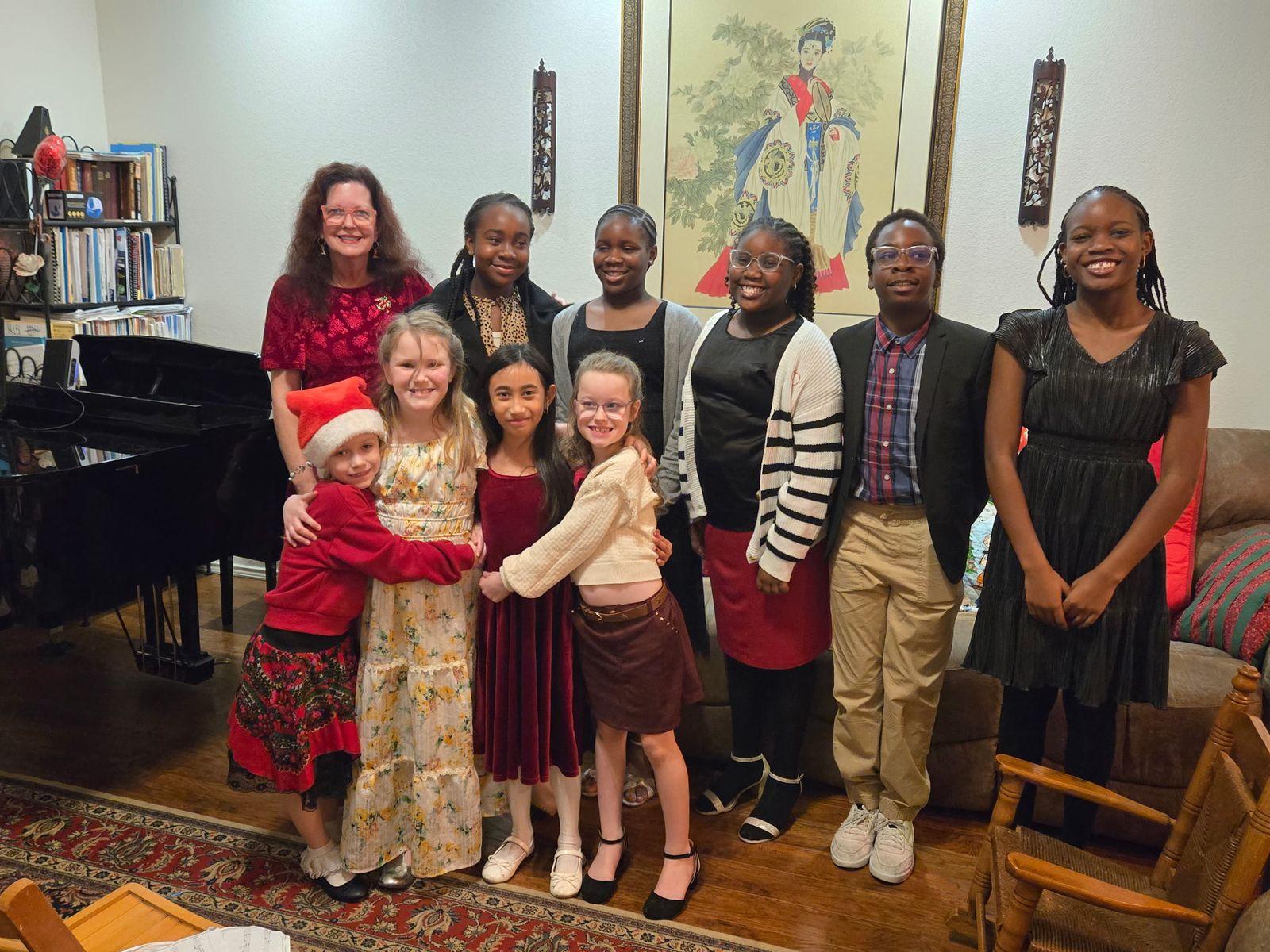 Judy Rohlin with a group of her piano students at a studio recital